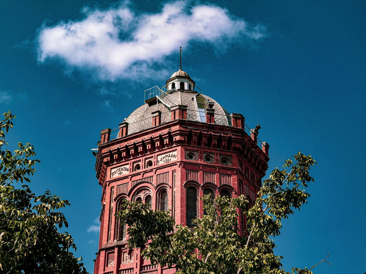 a tall tower with a clock on the top of it