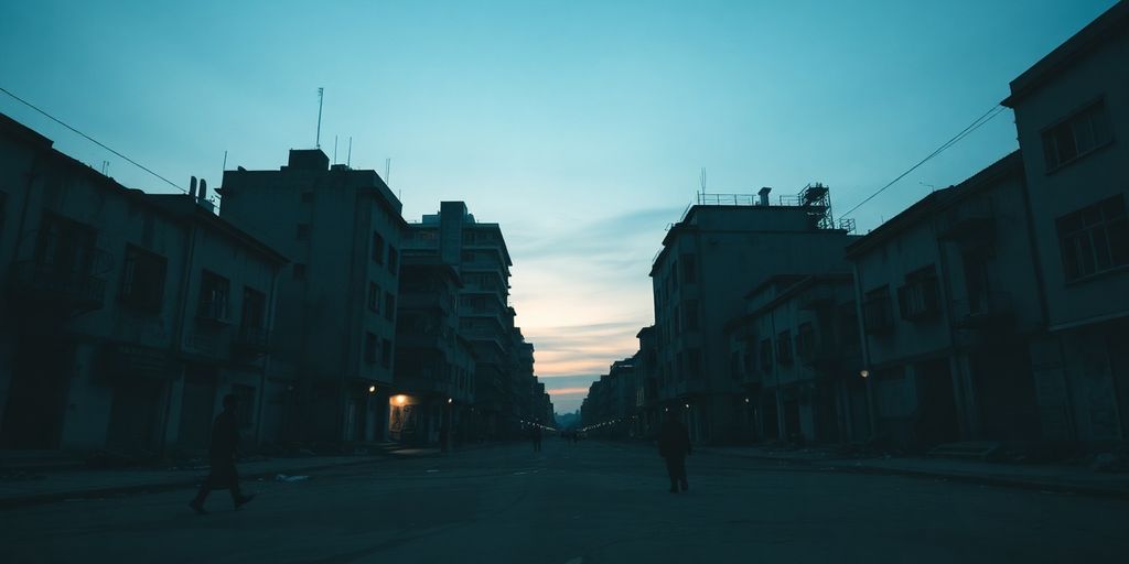 Distressed urban landscape, isolated figures, stark light.