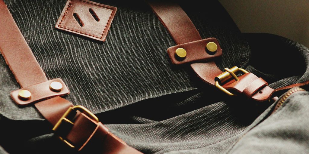 shallow focus photography of black rucksack
