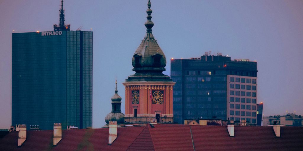 a city skyline with a clock tower in the middle