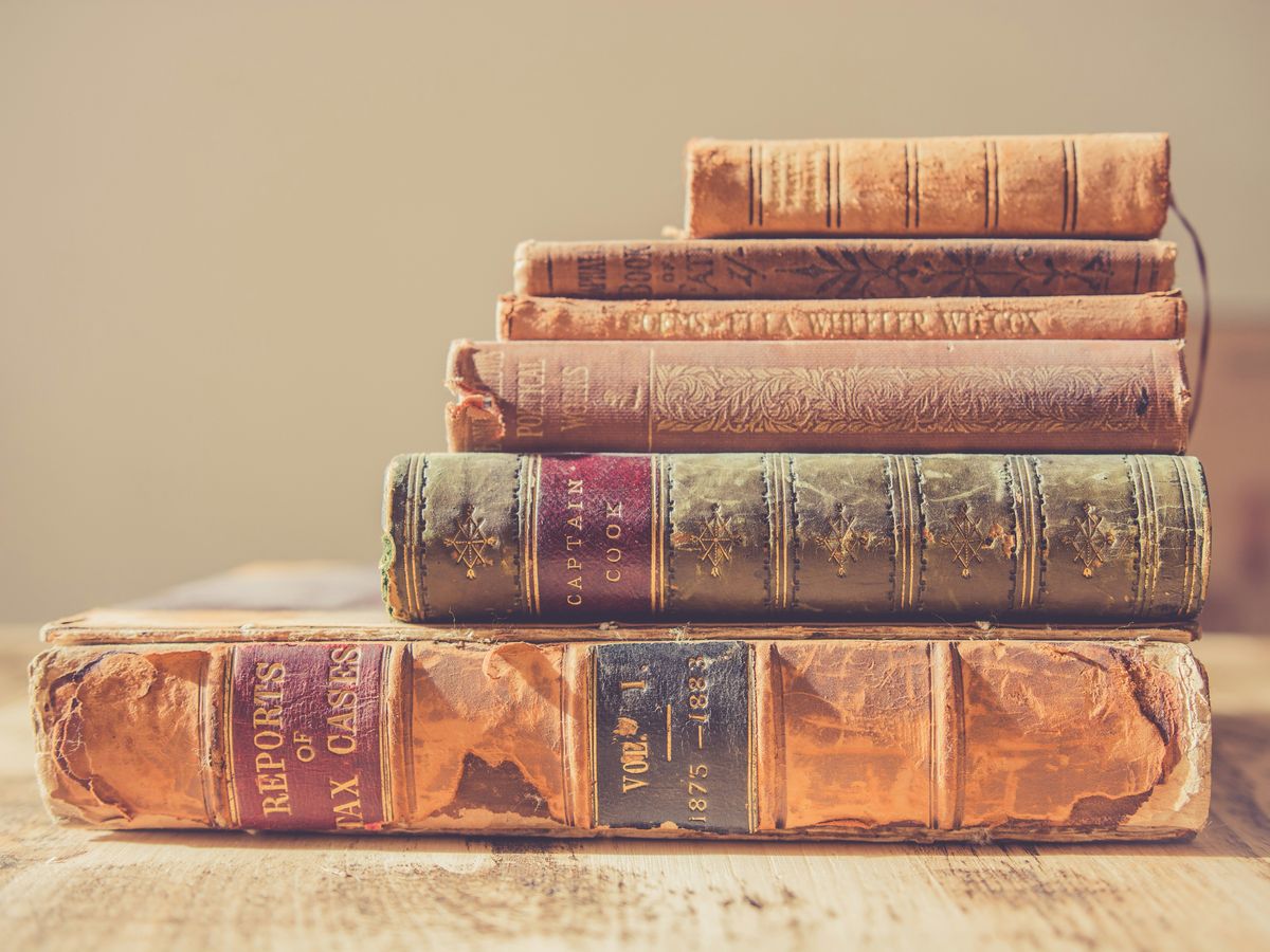 shallow focus photography of stack of books