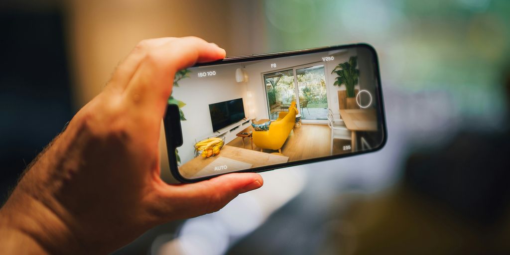 A person taking a picture of a living room