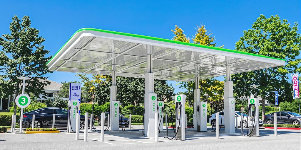Modern Level 3 EV charging station with electric vehicles.