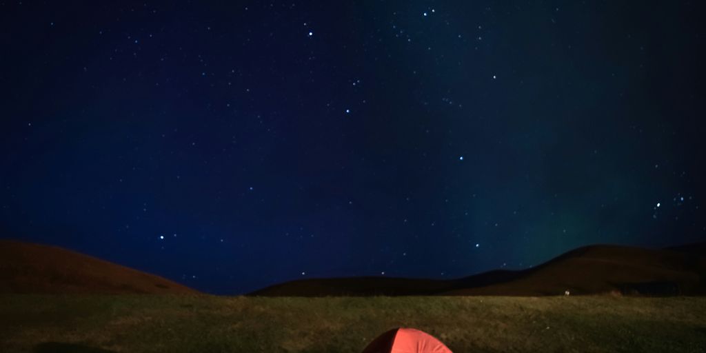 red tent under blue sky during night time