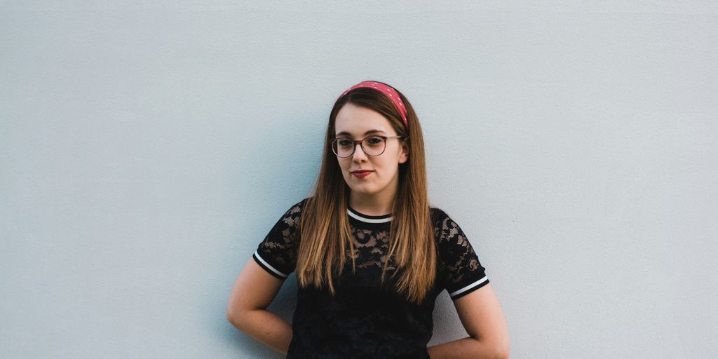 woman leaning on wall