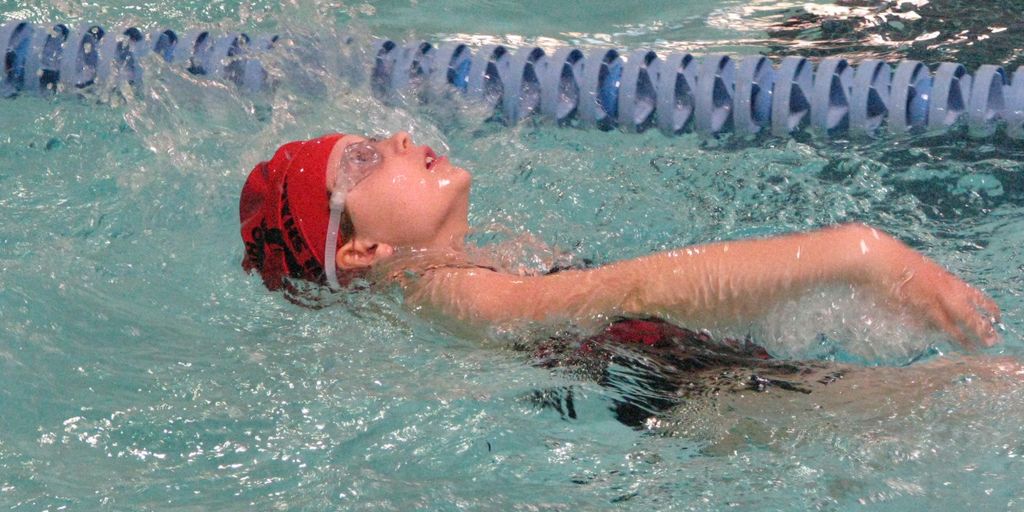 swimmer eating healthy food poolside