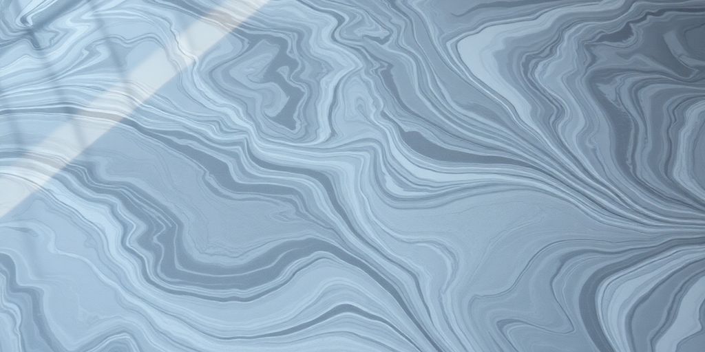 Swirling metallic epoxy floor, gray, silver, and white.