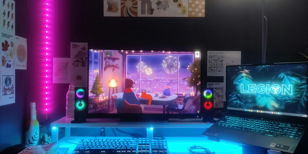 a desk with a laptop and a monitor on it