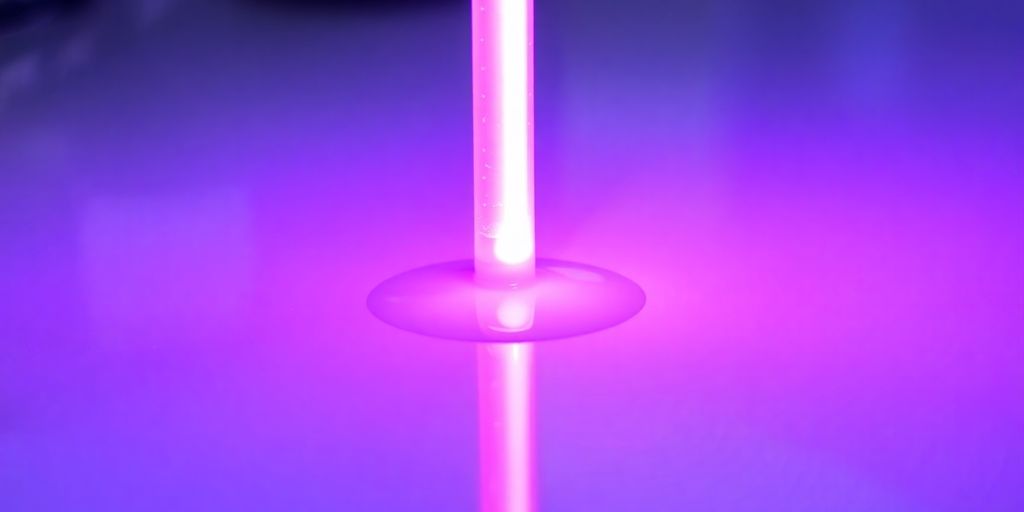 A close-up of a UV lamp curing a coating.