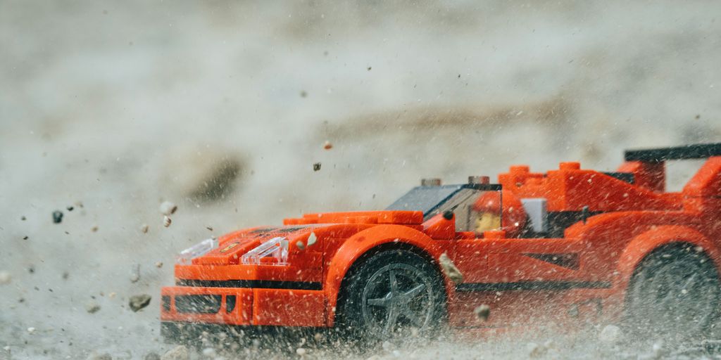 orange ferrari f 1 on water