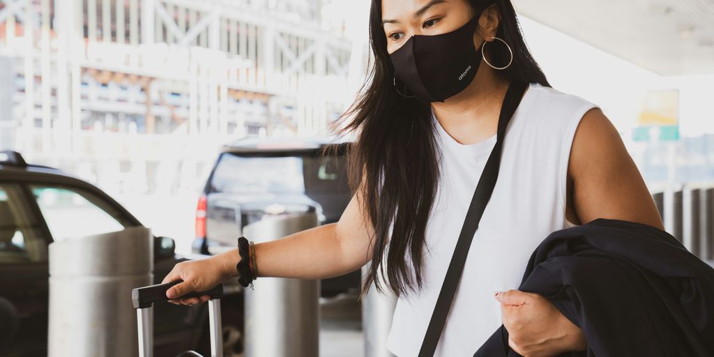 woman in black and white tank top wearing black sunglasses