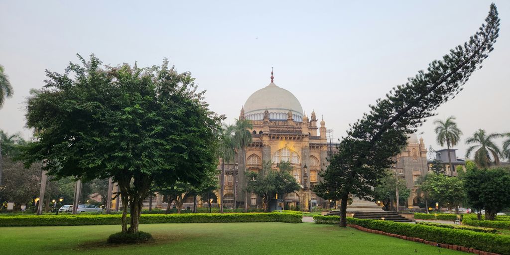A large building with a dome in the background