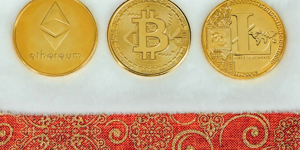 three gold bitcoins sitting next to each other