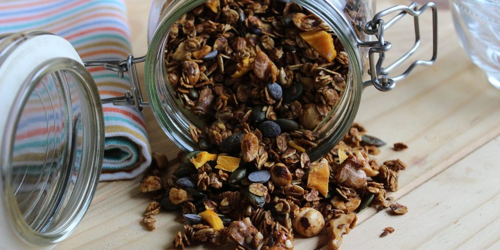 swimmer eating granola bar poolside