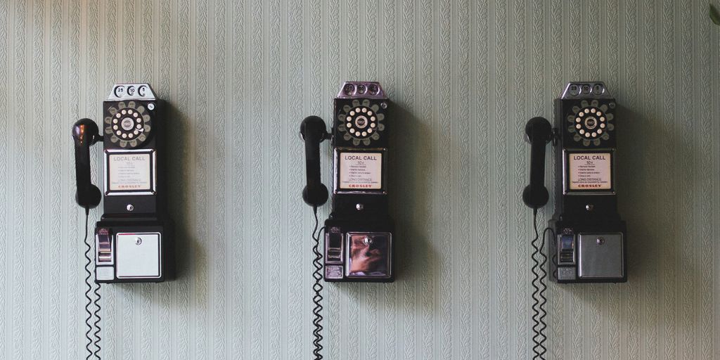 minimalist photography of three crank phones