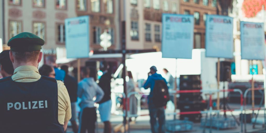 people walking on road near buildings