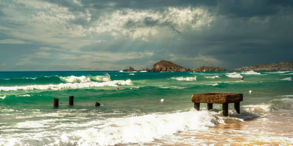 a body of water with waves coming in to shore