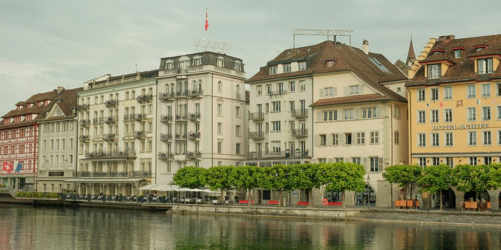 a row of buildings next to a body of water