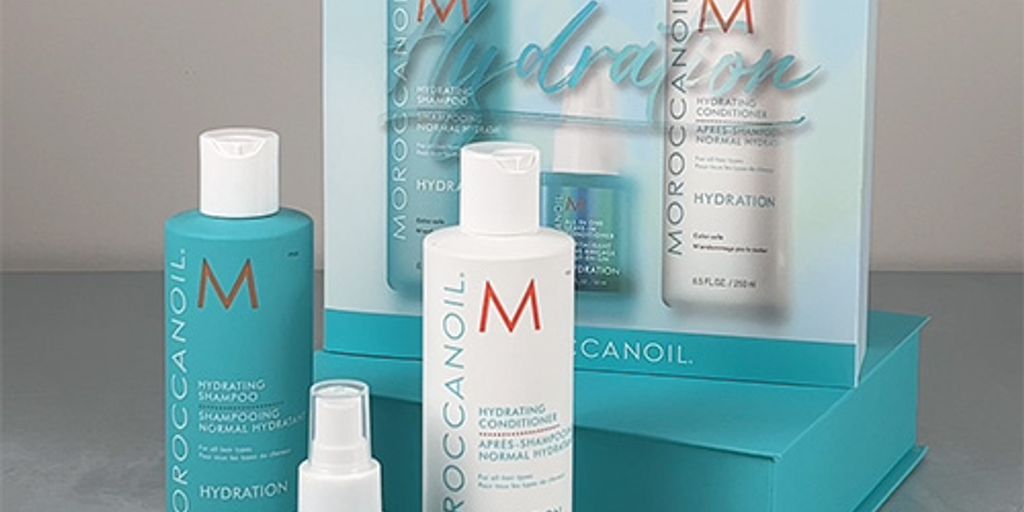 Moroccanoil hair care products display set with turquoise packaging.