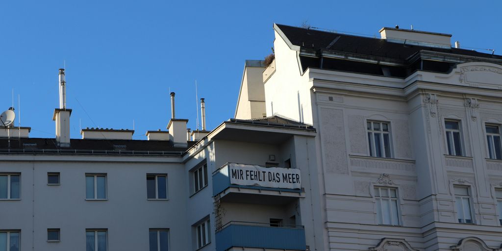 a white building with a sign on top of it