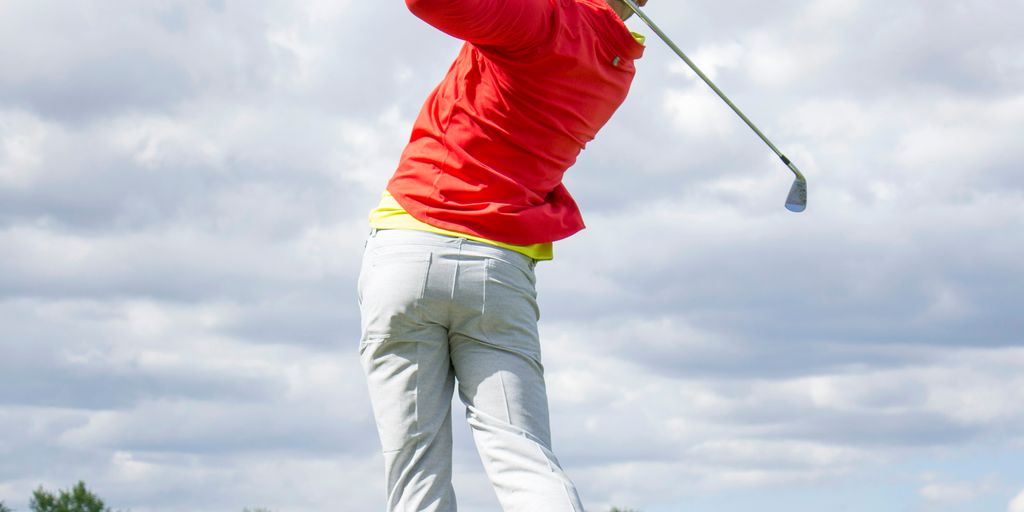 man in red long-sleeved top golf