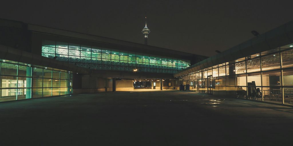 green and white building during night time