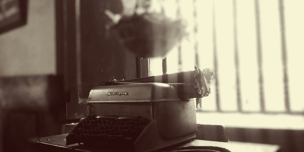 grayscale photo of Remington typewriter