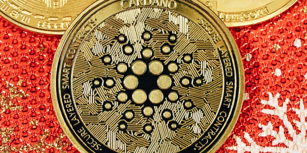 A close-up of a Cardano cryptocurrency coin on a surface.