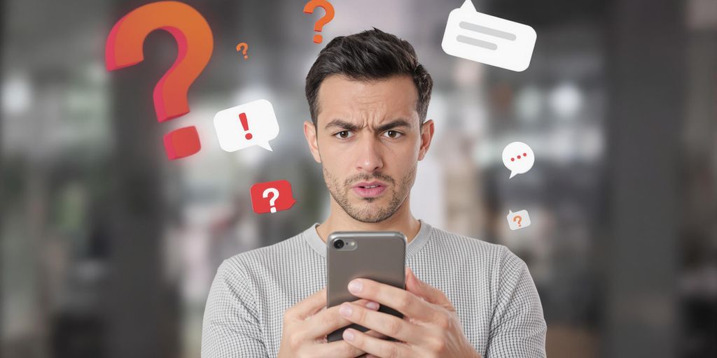 Une personne inquiète tenant un smartphone avec des symboles.