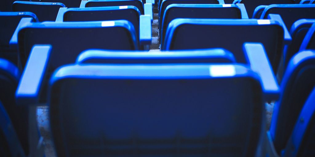 blue and black chairs in stadium