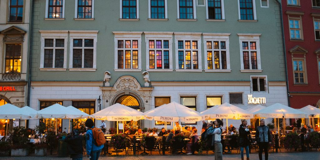 a group of people standing in front of a building