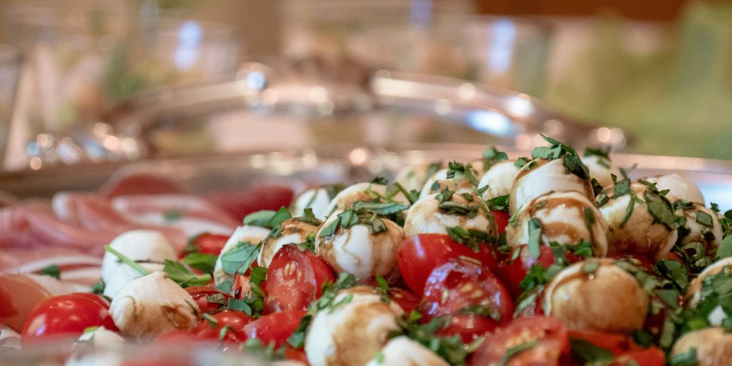 a plate of food that includes tomatoes and mozzarella