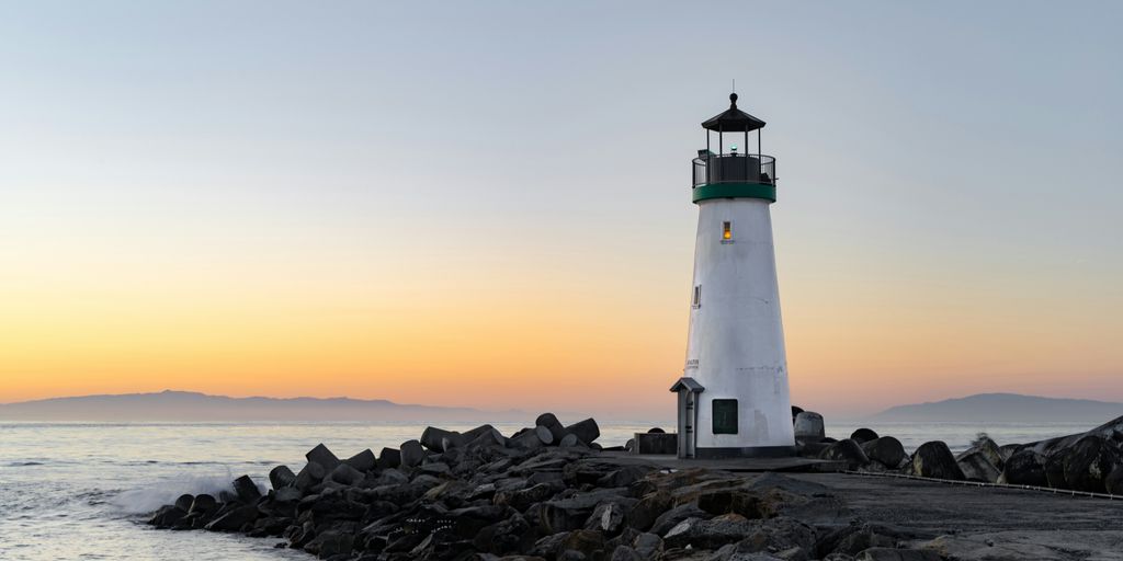 lighthouse near body of water