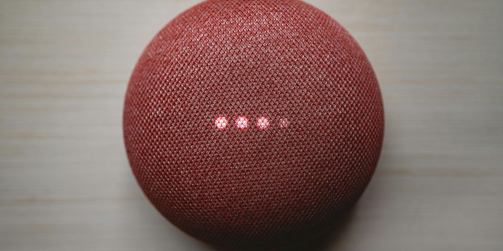 red round portable speaker on brown wooden table