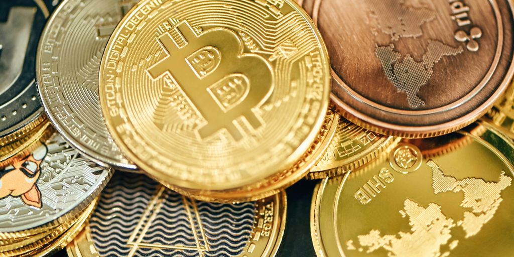 A collection of various cryptocurrency coins stacked together.