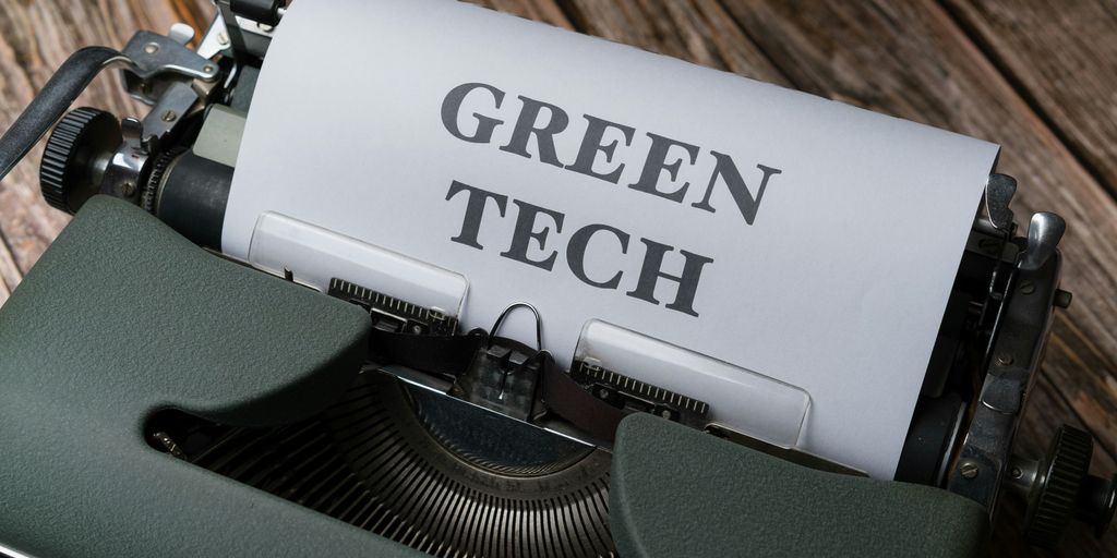 a close up of a typewriter with the words green tech on it