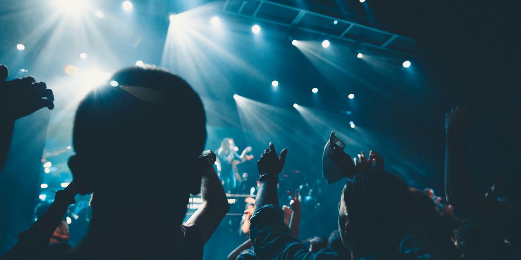 people standing in front of stage
