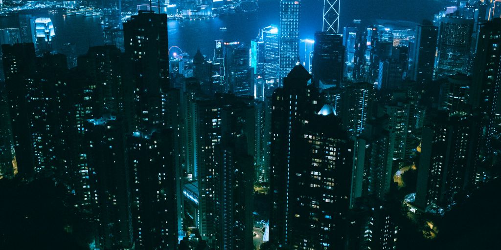 river surrounded with high-rise building during nighttime