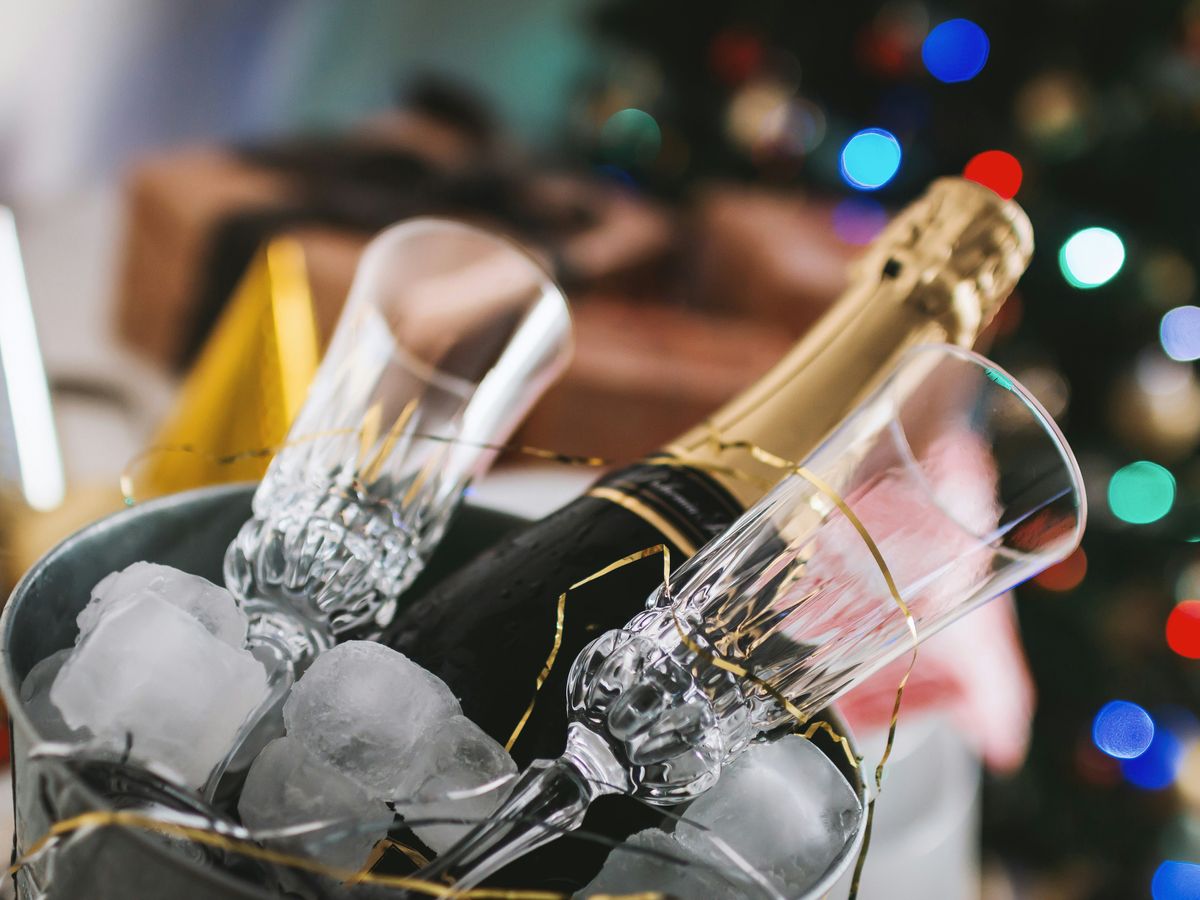 champagne bottle and glass in bucket