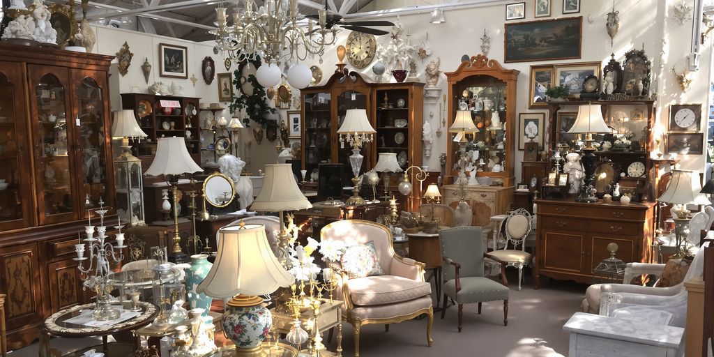 Antique furniture and decorative items in a shop.