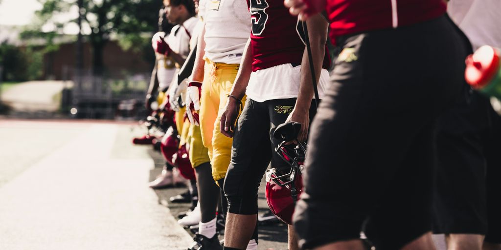 two yellow-and-red football jerseys