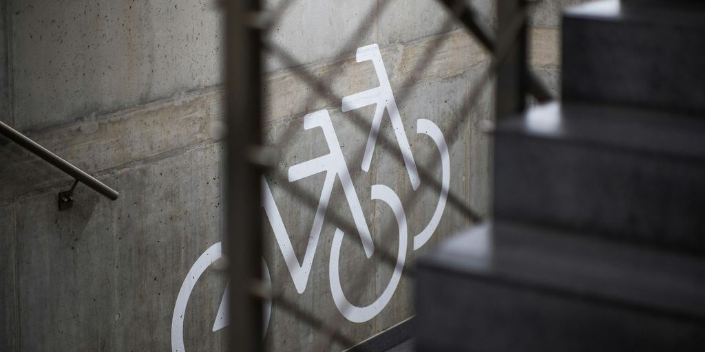 A close up of a bicycle sign on a building