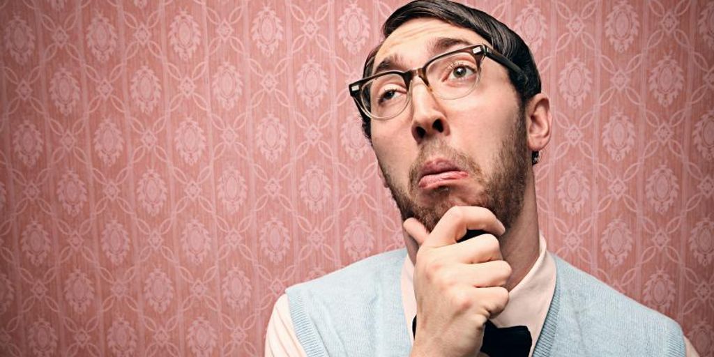 confused person looking at a website on a laptop