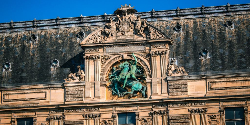 a building with statues on the side