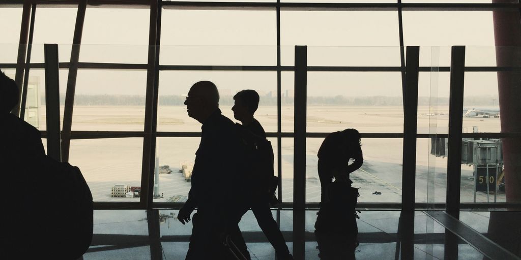 silhouette of people in the airport