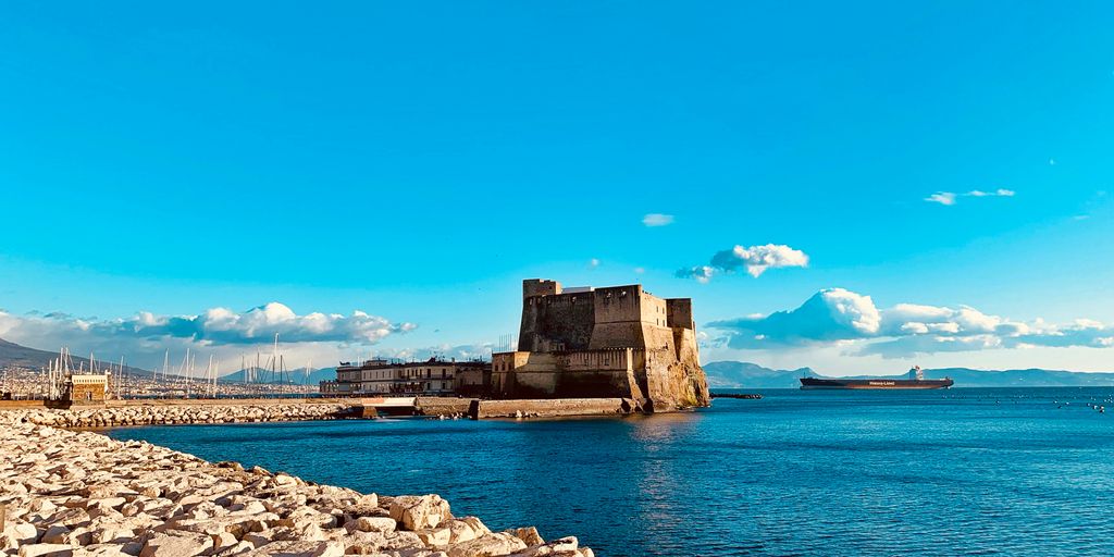 brown concrete tower beside sea during daytime