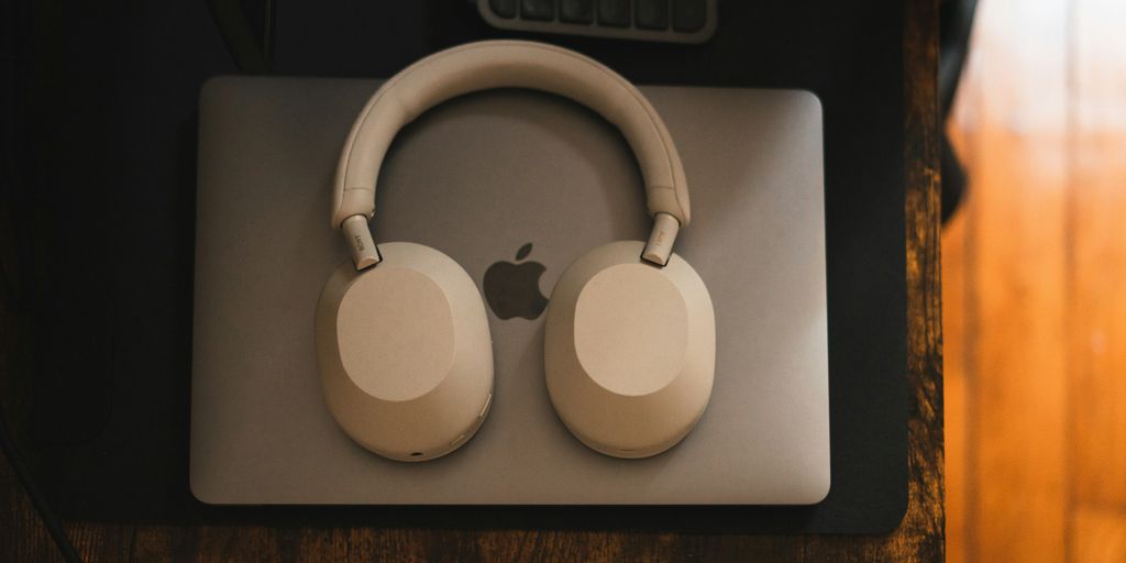 a pair of headphones sitting on top of a mouse pad