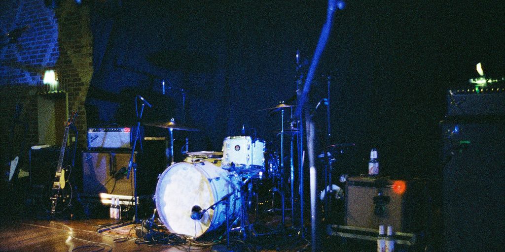 a group of musical instruments sitting on top of a wooden floor