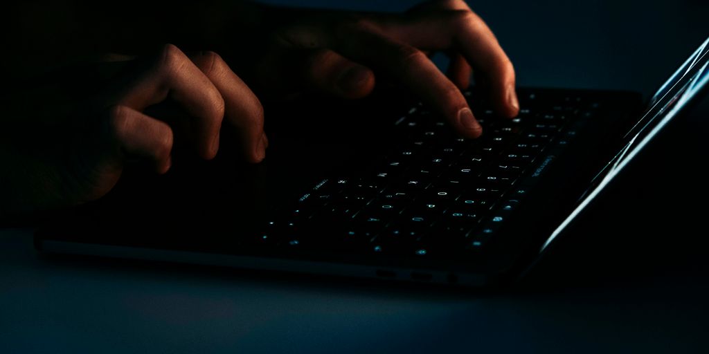 person using black laptop computer