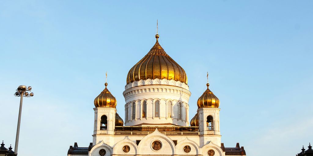 a large white building with a golden dome